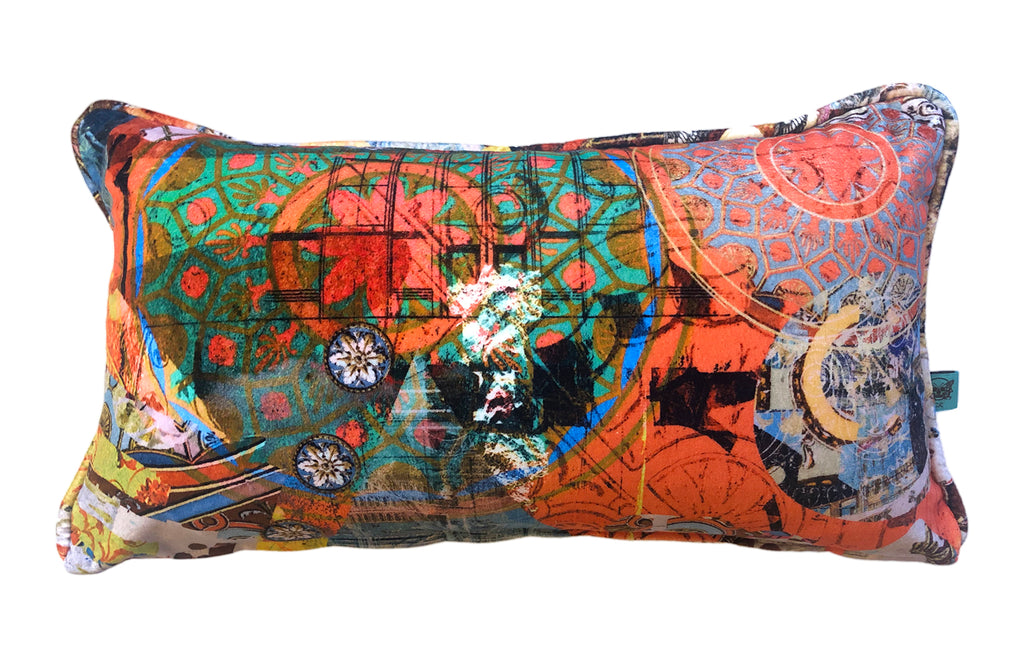 ‘Argo Navis’ velvet boudoir cushion featuring green, orange and blue abstract patterns. 