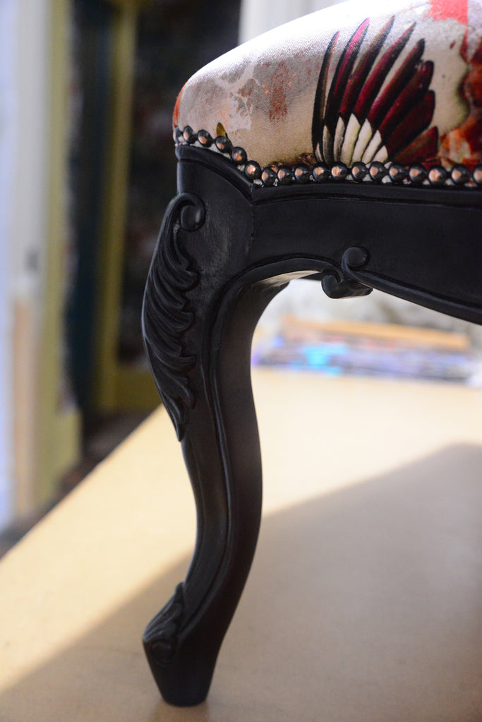 Hand-carved black footstool, Designer ottoman, Statement furniture, Luxury velvet upholstery, Contemporary classic furniture, Bird inspired velvet fabric, Furniture made in the uk, interiors shop in Derbyshire