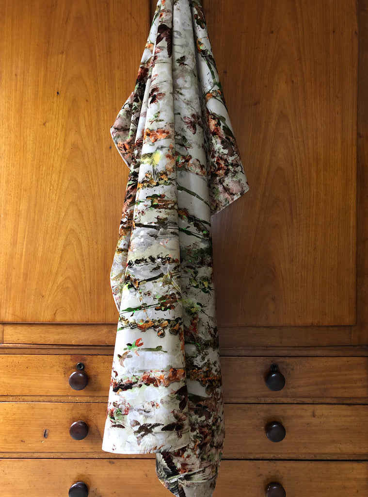 Ariel Dusk Fabric drop with birds and butterflies draped for display 