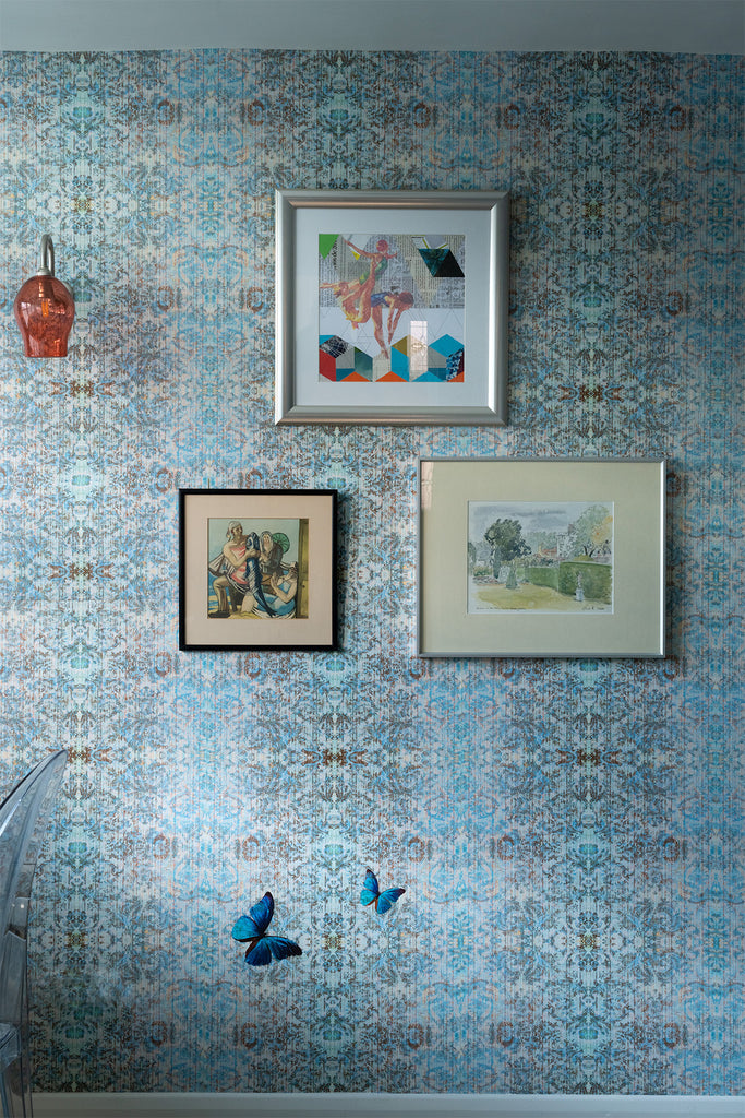Chapelle Morpho wallpaper luxury wallpaper in blue and cream damask print with butterfly details, styled with framed artwork and wall light