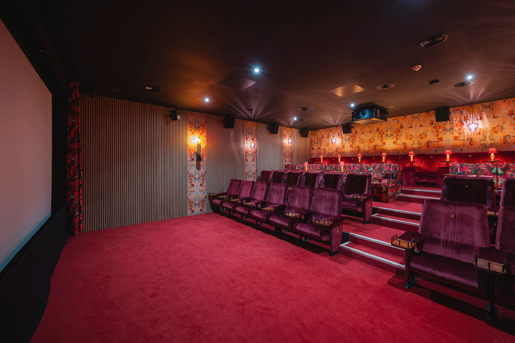 Cinema room interior space with Larson Retro designer wallpaper adding a retro-modern ambience
