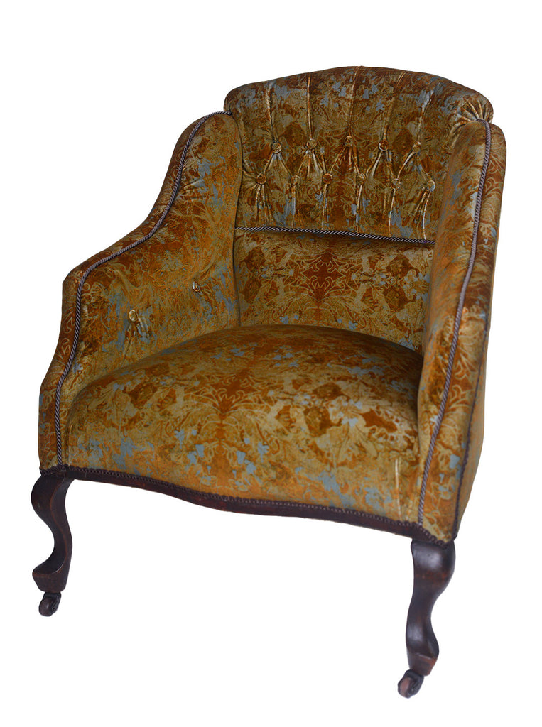 Garbo vintage-style armchair with ornate floral pattern on a white background.