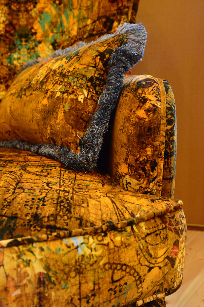 Modern accent chair upholstered in Henry velvet fabric with vibrant historic design 