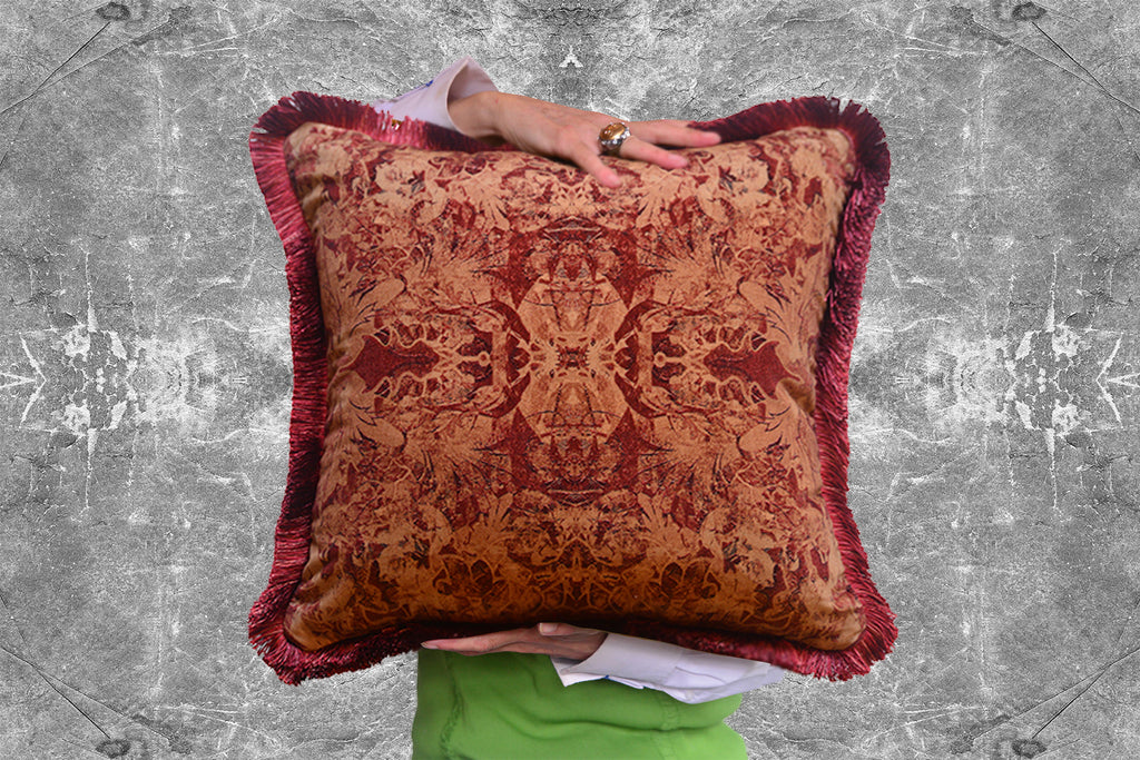 Josephine decorative pillow with intricate patterns against a textured gray background