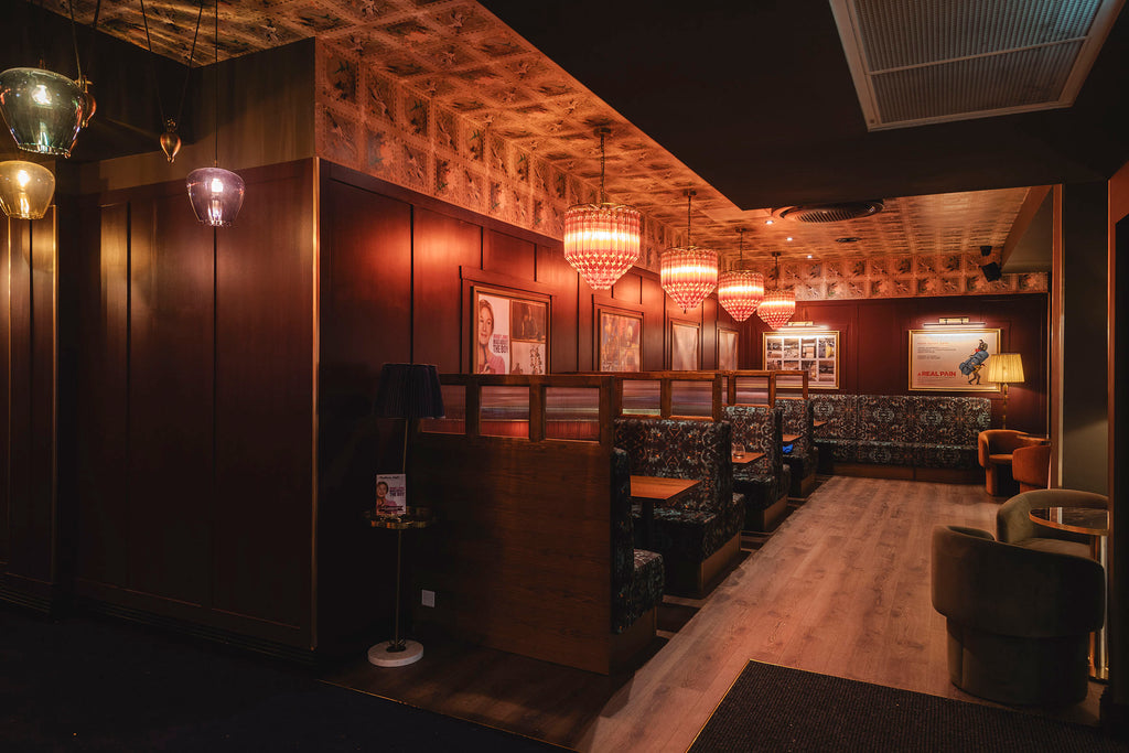 Cinema venue string with upholstered banquette seating in Monk velvet 