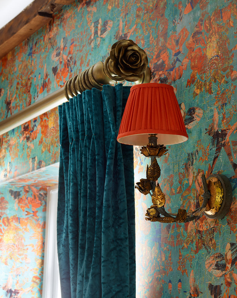 Mary wallpaper in teal and orange luxury designer wall covering with golden wall light and orange light shade