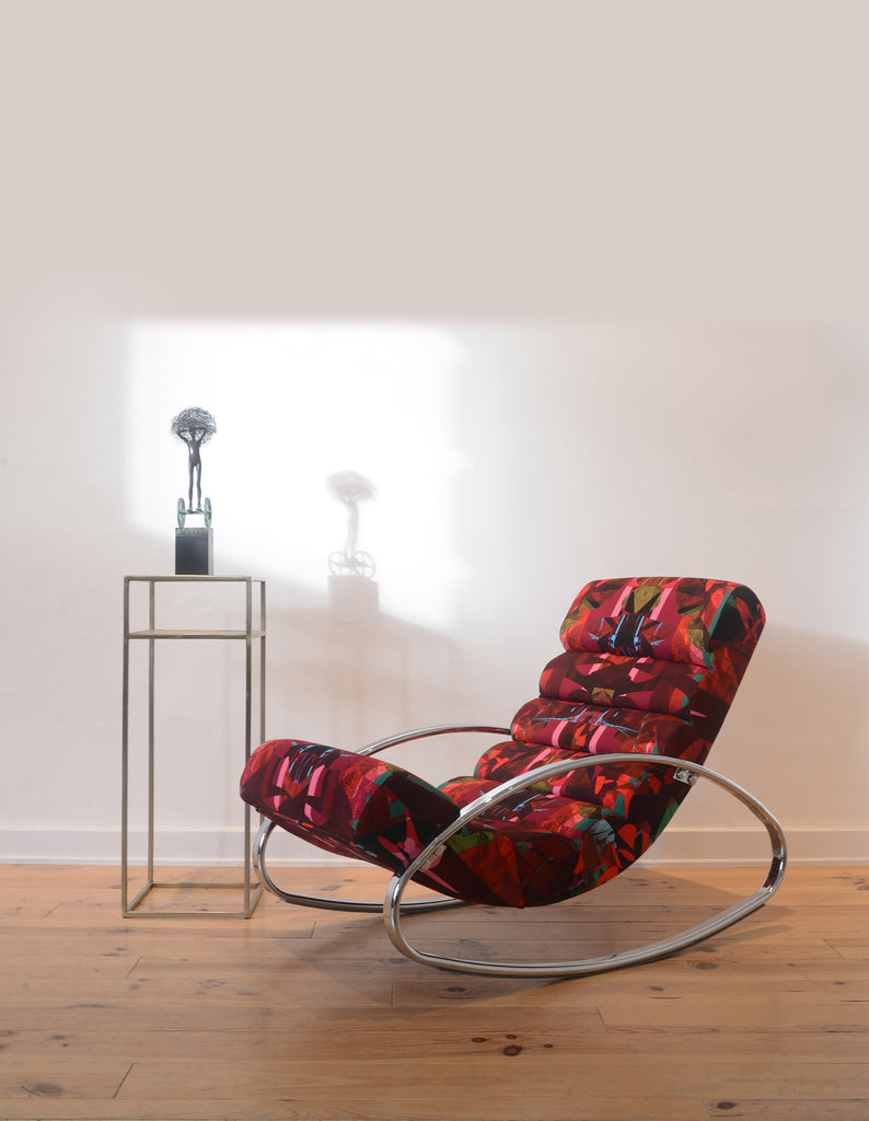 ‘Stevie at the Ritz’ wave chair in an empty white gallery wall styled with a metal sculpture. 