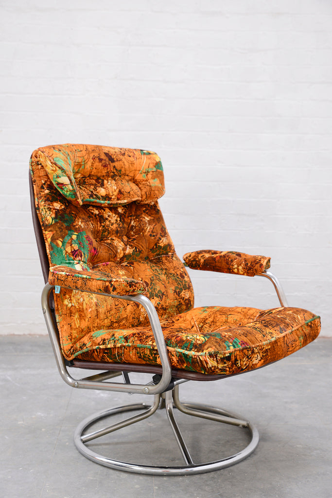 Mid-century chrome office chair upholstered in Henry luxury designer velvet in orange, green and red details 