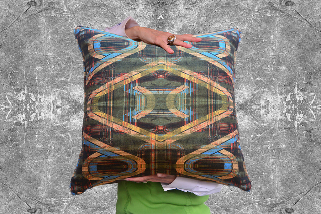 Tartan with a Slice is Blackpops Green and Yellow Geometric cushion, being held in this image by someone