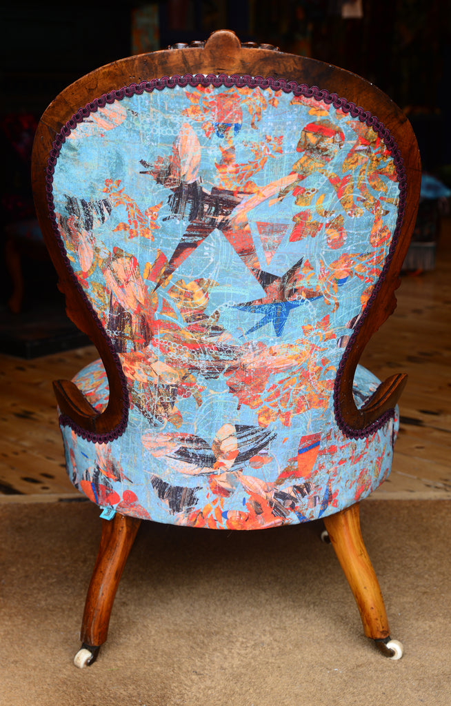 Rear view of Victorian chair upholstered in Mary velvet with blue & orange abstract pattern. 