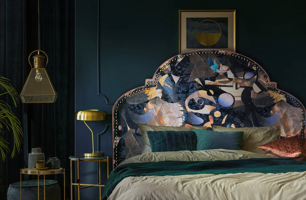 ‘Labyrinth’ velvet studded headboard styled in a navy interior room with gold accents. 