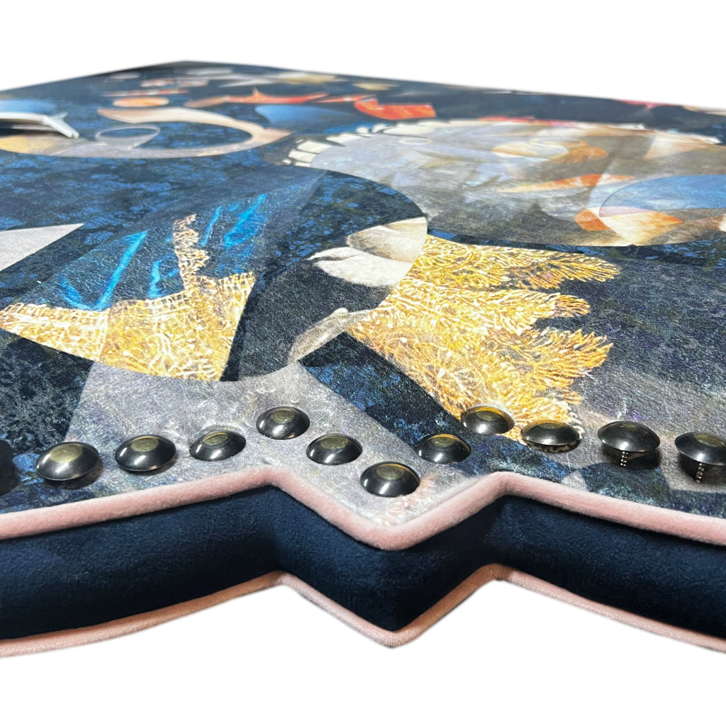 Close-up ‘Labyrinth’ velvet headboard featuring brass studded finishing. 