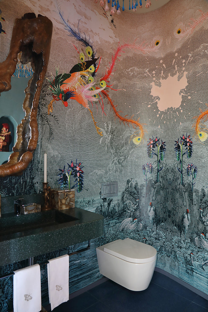 ‘Paradise Lost’ wallpaper mural featuring a vibrant mythical bird styled in a modern, small bathroom. 