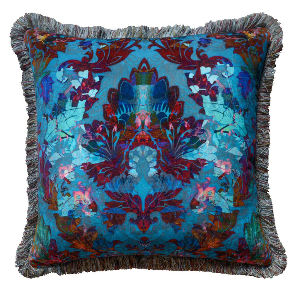 Orpheus cushion cut-out showing bold symmetrical velvet design in teal, purple and gold on a square scatter cushion. 