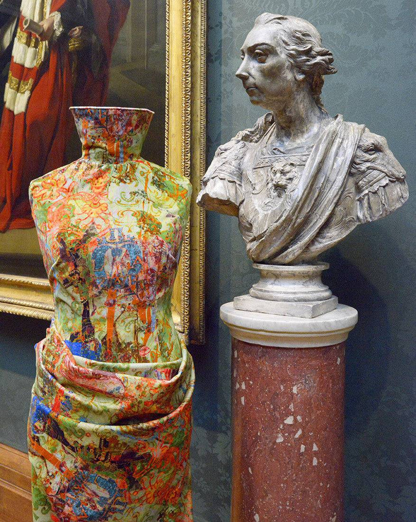 Elizabeth fabric on display - historical print in green and red with bust sculpture and Tudor styling 
