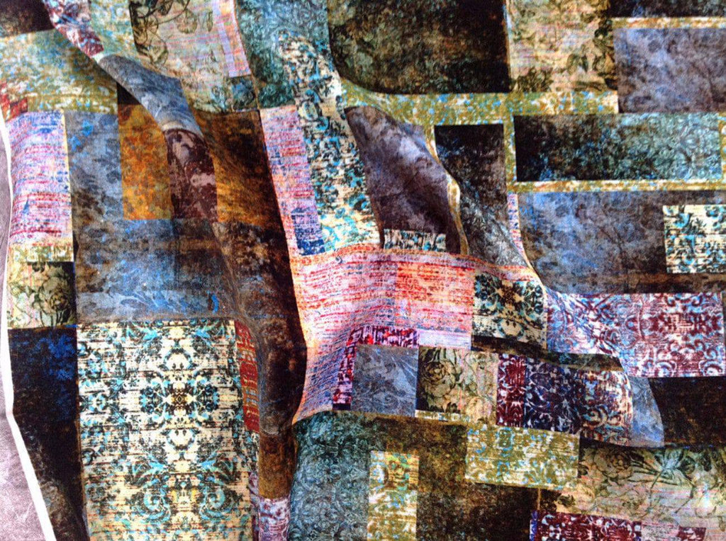 Draped Culcita Emerald fabric - layered green velvet with faded block pattern and vintage textile influence 