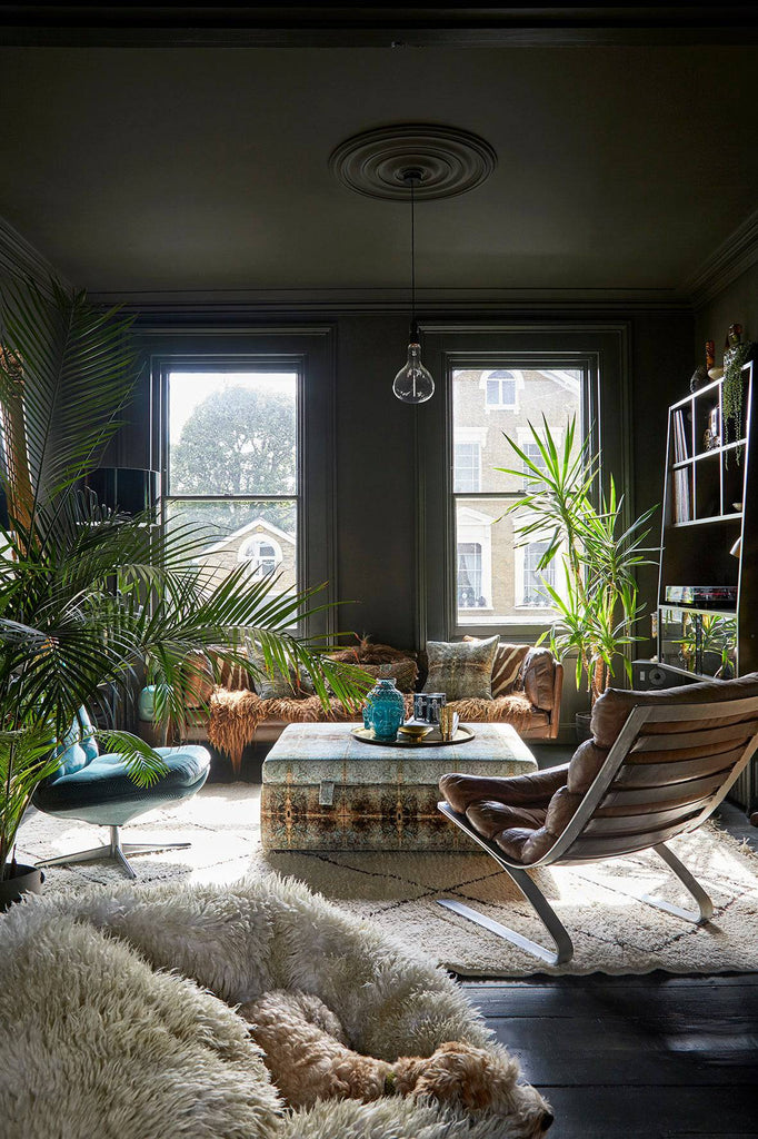 Room with Duprez pouffe - distressed damask fabric in soft blue and gold, styled in modern interior 