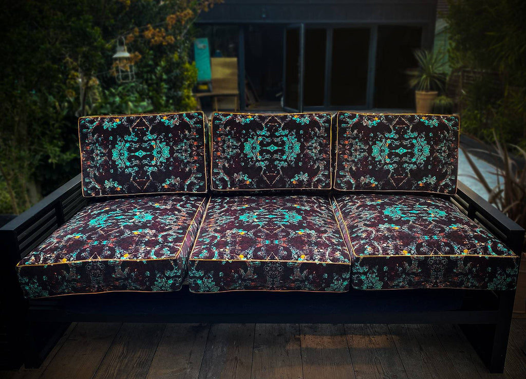 Outdoor sofa seating upholstered in Monk in a garden setting 