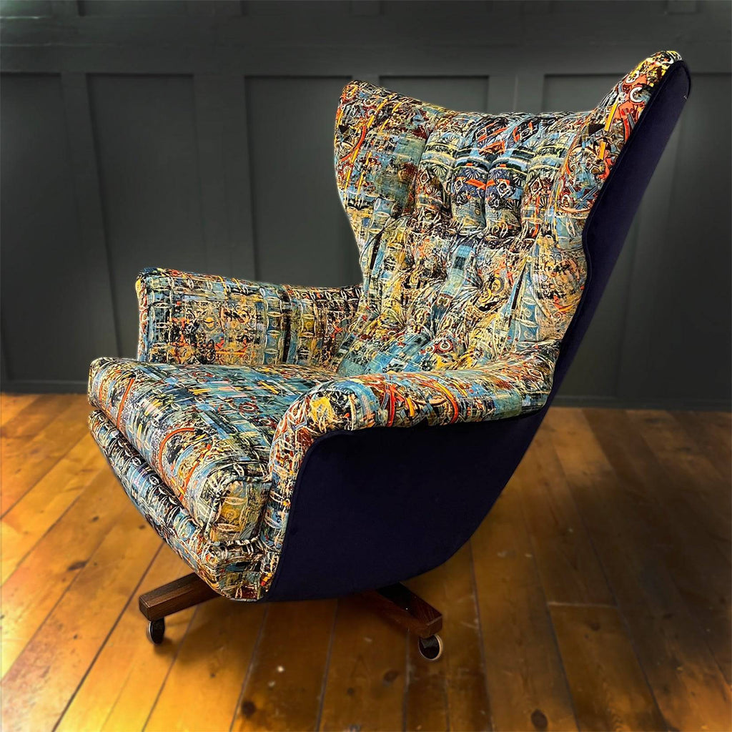 Capriccio fabric on high-back armchair in rustic wooden-floor room 