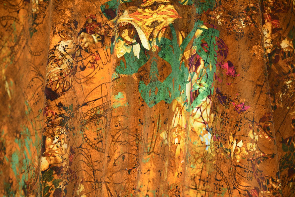 Close-up of Henry luxury velvet showing intricate design inspired by Tudors in oranges, greens and reds