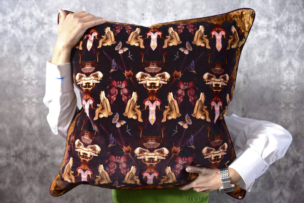 Reader fabric designer cushion featuring mirror surrealist artwork in rich tones
