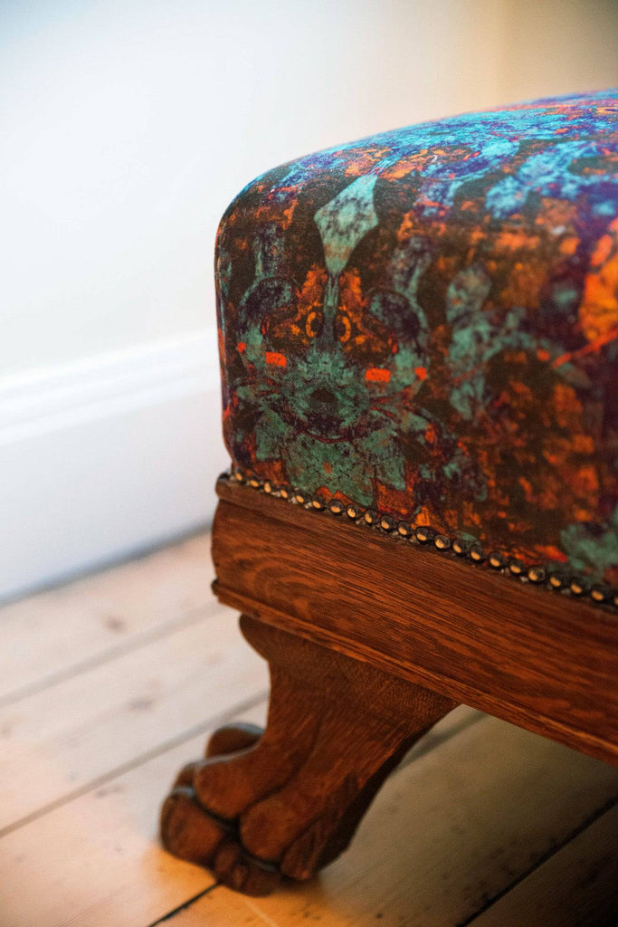 Footstool upholstered in Rosetta sustainable velvet fabric with intricate abstract pattern 
