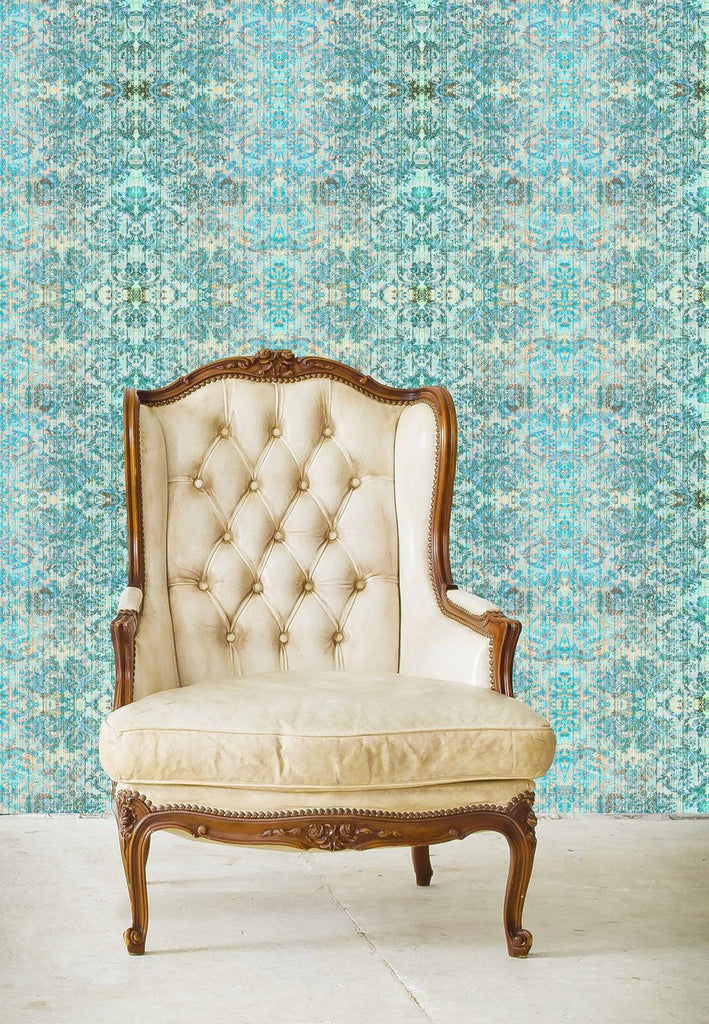 Chapelle Noon wallpaper behind a cream Depp buttoned upholstered chair. 