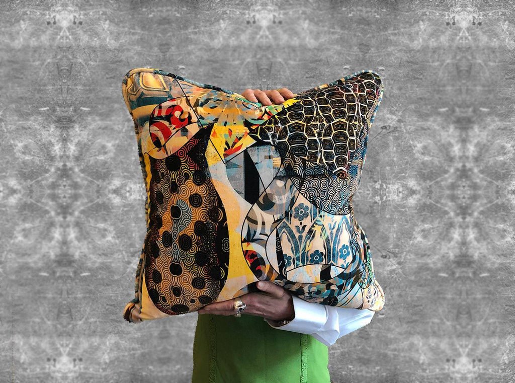 Walladawn velvet designer cushion featuring African inspired patterns and yellow, red and blue colours 
