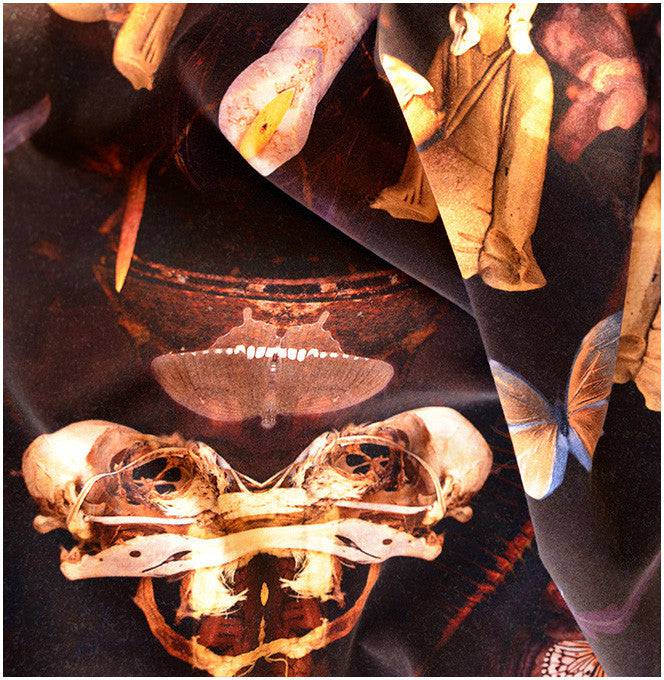 Close-up Grand Reader fabric highlighting symmetrical surrealist figures and motifs 