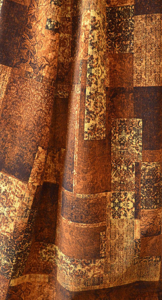 Culcita Amber luxury golden fabric draped showcasing floral and damask detail in colours of browns and golden tones 
