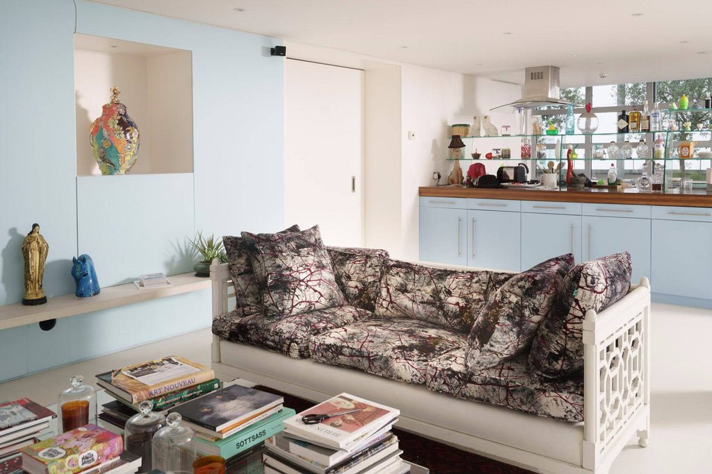 Vanguard Vibe sofa upholstered in luxury abstract velvet with bold red and grey expressionist pattern 